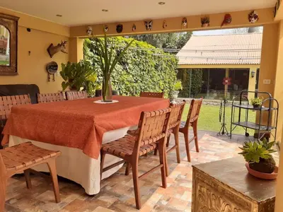 a dining room with a table and chairs at Hostal Sol Y Luna - Cieneguilla in Cieneguilla