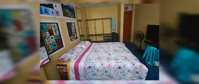 a bedroom with a bed with a blanket on it at Nazcazone in Nazca