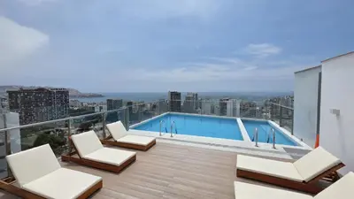 a balcony with a swimming pool on top of a building at Nordic Barranco by PERU STAY in Lima
