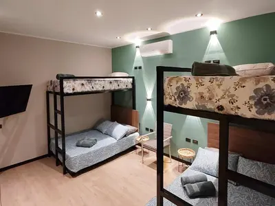 a room with two bunk beds and a couch at Quiet 4BR Villa with Pool & Terrace in Ica
