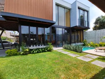a house with a large window and a yard at Quiet 4BR Villa with Pool & Terrace in Ica
