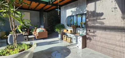 a patio with a potted plant and a tree at Private 4BR Getaway with Pool & Cinema in Ica