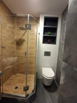 a bathroom with a toilet and a glass shower at Beach House - Besso Beach in Barranca