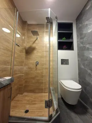 a bathroom with a shower with a toilet and a sink at Beach House - Besso Beach in Barranca
