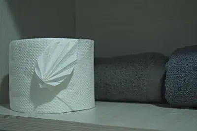 a roll of paper towels sitting on a shelf at Cesar's Apartment - Los Laureles in Lima