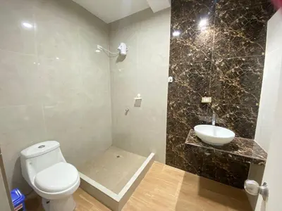 a bathroom with a toilet and a sink at Ruta del Oasis - Huacachina in Ica