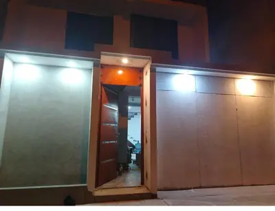 a mirror on the side of a building with lights at Ruta del Oasis - Huacachina in Ica