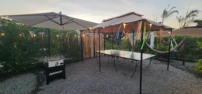 two umbrellas and a table with a rope at Quiet 3BR Country Villa whit BBQ in Ica