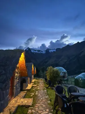 a stone building with a view of a mountain at Salkantay House in Anta