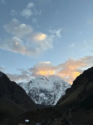 a snow covered mountain in the middle of a valley at Salkantay House in Anta