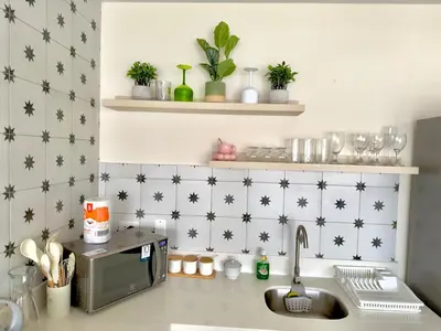 a kitchen with a counter top with a sink at Modern apartment a short walk from the boulevard and beach in Punta Hermosa