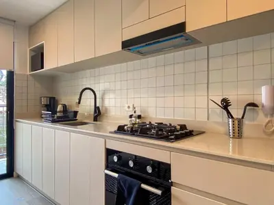 a kitchen with a stove and a sink at Enchanting Loft with Balcony in Barranco in Lima