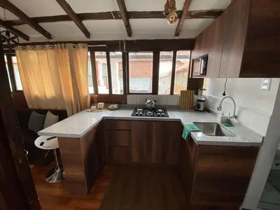 a kitchen with a sink and a counter top at Acogedor Departamento Vitoque in Cusco
