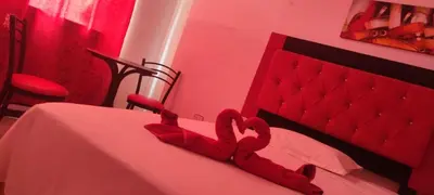 a bedroom with a red bed with hearts on it at HS OASIS pro lima in Lima
