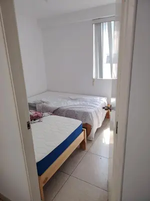 a bedroom with two beds and a window at San bartolo 2 in San Bartolo