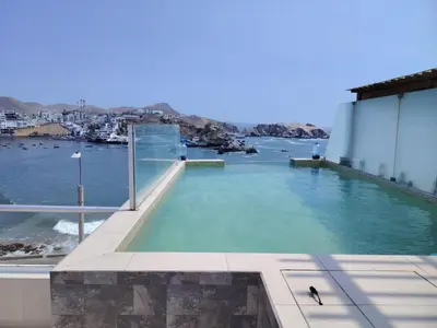 a swimming pool with a view of the water at San bartolo 2 in San Bartolo