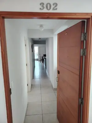 a door leading into a hallway with a house number at San bartolo 2 in San Bartolo