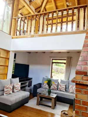 a living room with a couch and a table at Beautiful house in the Sacred Valley, Arin Falls in Calca
