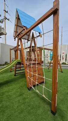 a playground with a net on the grass at Exclusive apartment in San Bartolo in San Bartolo