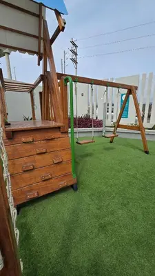 a playground with a green pipe in a yard at Exclusive apartment in San Bartolo in San Bartolo