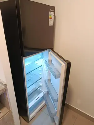 an empty refrigerator with its door open in a room at JAVIER PRADO ESTE 1501 LOFT- FRENTE a SAN BORJA in Lima
