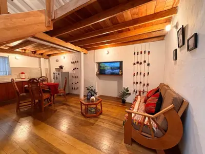 a living room with a couch and a table at Andes Home in Cusco