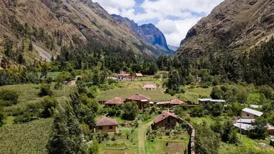an aerial view of a village in a mountain valley at Cabin in Inca Sanctuary in Ollantaytambo