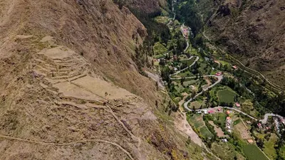 an aerial view of a winding road on a mountain at Cabin in Inca Sanctuary in Ollantaytambo