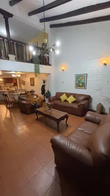 a large living room with couches and a table at Apartamento Plaza de armas de Ayacucho in Ayacucho