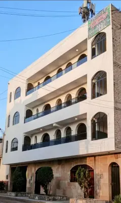 a building in the city of jerusalem at Modern Apartament Pool & Jacuzzi 1 room in Lima
