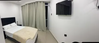 a small bedroom with a bed and a window at Prado hotel in Chancay