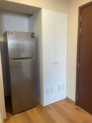 a kitchen with a stainless steel refrigerator and a cabinet at Anime-Style Studio Decor in Lima