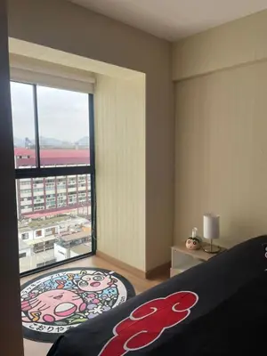 a bedroom with a large window with a view of a city at Anime-Style Studio Decor in Lima