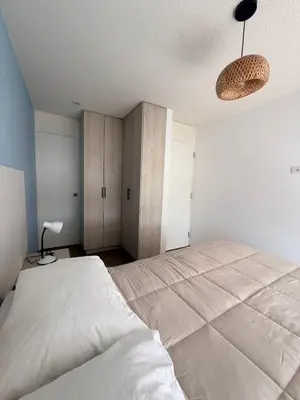 a bedroom with a large bed in a room at Departamento con vista al Mar in San Bartolo