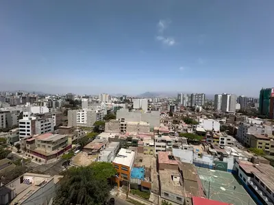 a city view of a city with buildings at Departamento en barranco in Lima