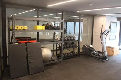 a room with a gym with a lot of equipment at Modern apartment in Larco 791 in Lima