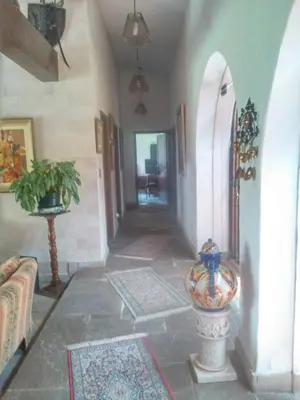 a hallway of a house with a living room at Nice country house with a swimming pool and large garden in Cieneguilla