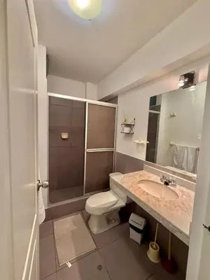 a bathroom with a toilet and a sink at Casa de Liz in Lima