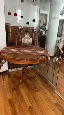 a wooden table with a bowl on top of it at Xima Cusco Kenamari in Cusco