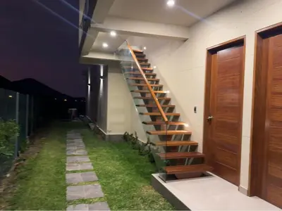 a spiral staircase on the side of a building at House 3M in Condominium Fundo Pradera, Chocaya - Lima - Perú in Asia