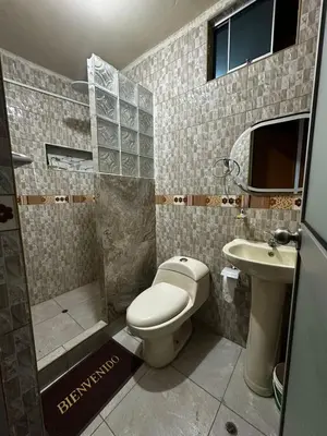 a bathroom with a toilet and a sink at Quinta Maravillas in Ayacucho