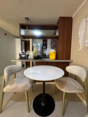 a kitchen with a white table and two chairs at Flat 1BR San Miguel cerca a Malecón con balcón in Lima