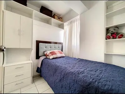 a bedroom with a blue bed and a white cabinet at A cozy apartment in the heart of Miraflores in Lima
