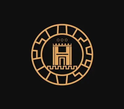 a golden logo with a crown on a black background at Hotel MachuPicchu Humantay in Machu Picchu