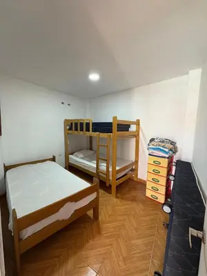a bedroom with two bunk beds in a room at Casa playa in Barranca