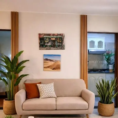 a living room with a couch in a room at Modern y Cozy Apartment Prime Location Fast WiFi in Lima