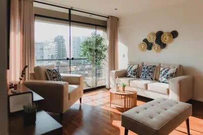 a living room filled with furniture and a large window at Recavarren 3 Dormitorios by Casa Miraflores - Wifi - Washer - Hot Water in Lima