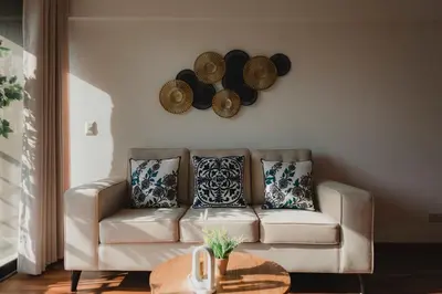 a living room with a couch and hats on the wall at Recavarren 3 Dormitorios by Casa Miraflores - Wifi - Washer - Hot Water in Lima