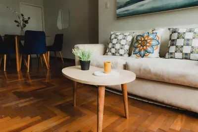 a living room with a couch and a table at Galvez 3 Dormitorios by Casa Miraflores - Wifi Washer Hot Water in Lima