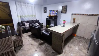 a living room with a couch and a table at Victoria home san blas in Cusco